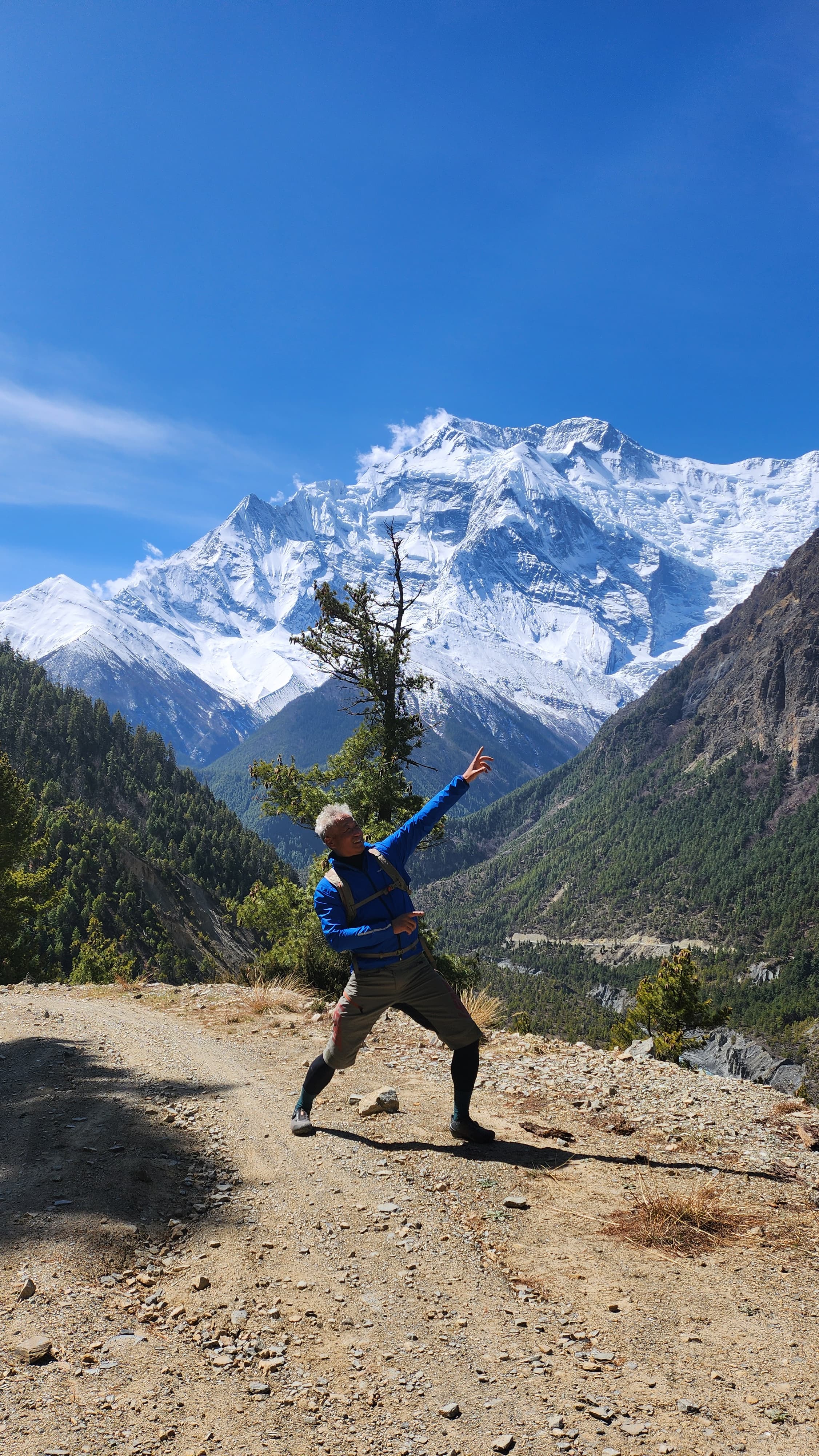 Cyclists riding through sweeping mountain scenery